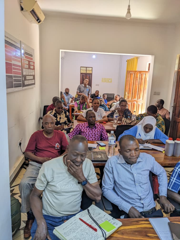 Participants listening attentively during training